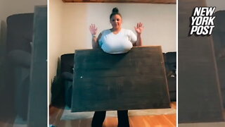 Woman lifts table, barbell with her humongous breasts