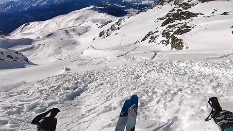 Massive Avalanche During Ski Drop From Mountain Summit