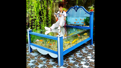 A masterpiece made from cement and glass! Beautiful outdoor aquarium bed