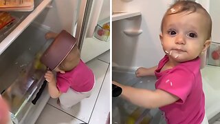 Hungry baby eats rice right out of the fridge