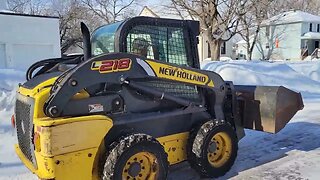 Unloading skid steer.