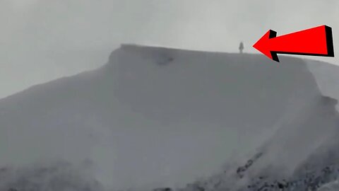 A Canadian man captured footage of what appears to be an enormous figure standing atop a mountain