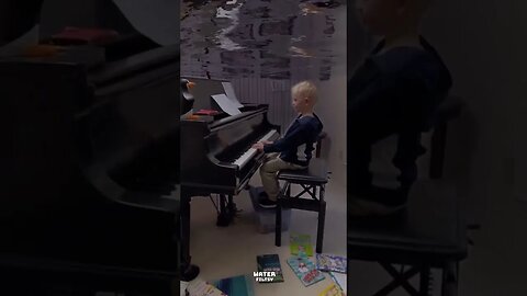 Water World playing a piano underwater