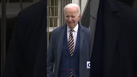 Joe Biden grabs reporter's hand — and won't let go