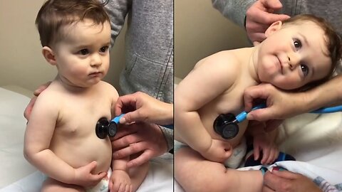 Sweet Baby Boy Rests Head On Nurse's Hand During Check-up