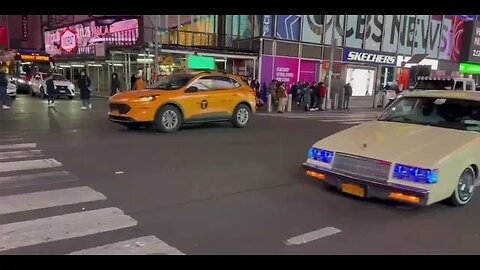 Time Square -Low Riders passing by.