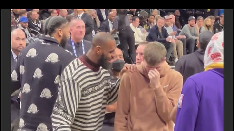 Lebron James at courtside Barclays center watching his lakers