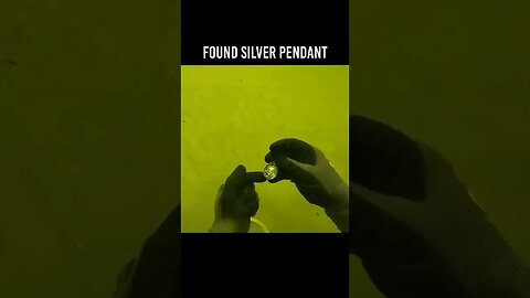 I found a Silver Necklace pendant in the river treasure hunting