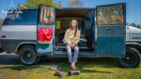 Musician lives in basic van build to save $$$ and play music.