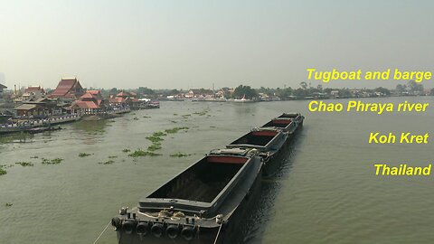 Tugboat and barge at Chao Phraya river Koh Kret Thailand