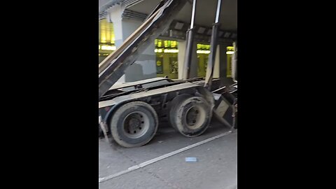 Dump Truck Hits Bridge In Toronto
