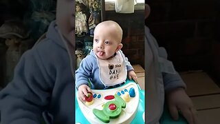 Cute Baby Boy Pulling Tongue Out