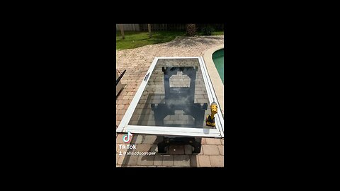 Sliding glass door repair; roller replacement and track refurbishing, in Coral Springs, Fl.