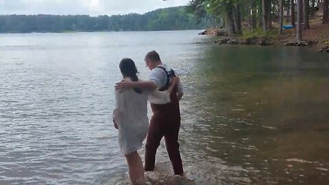 Man baptizes his daughter
