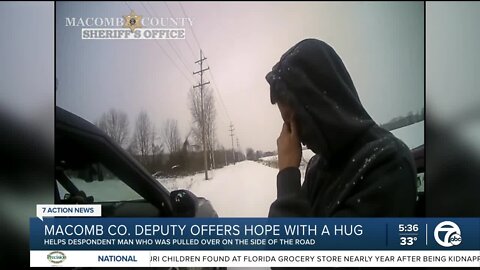 Macomb County Deputy offers hugs to driver in distress on side of the road