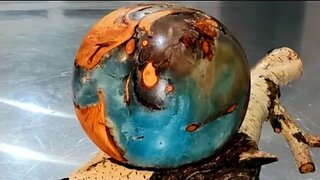 "Our Precarious World" Resin, Willow wood sphere on Birch lathe turned. O.U.R. at ArtForOUR.org