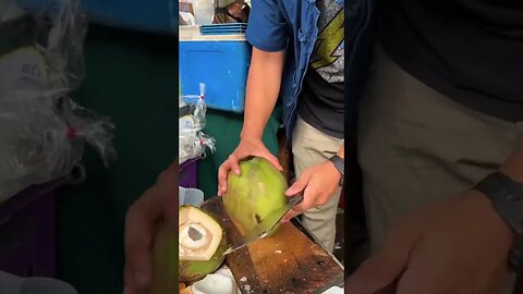 Grabbing a coconut in Chiang Mai Thailand