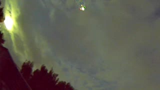 Plane captured on Sony night color camera 180 fisheye lens can see red & green flashing wing lights