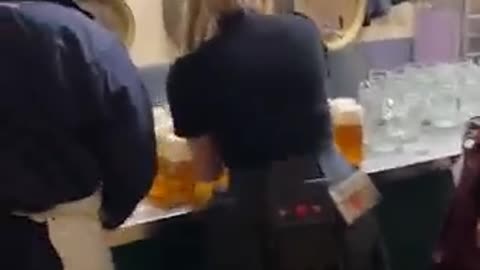 Waitress carries beer 🍻 like Hercules