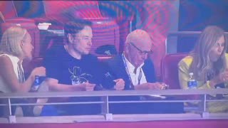 Elon sitting with Rupert Murdoch