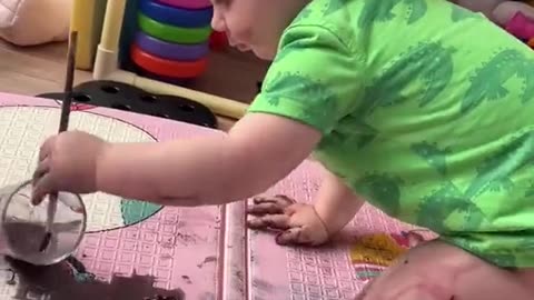 Little Girl Paints With Watercolor