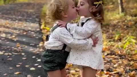 Cute girl and boy kiss each other