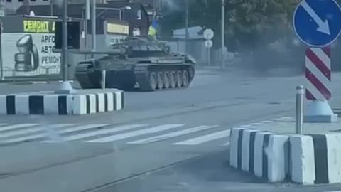 Ukrainians Driving Trophy Russian Tank Through Kharkiv