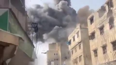 Horrific footage shows the moment Israeli airstrike targets a building in Gaza