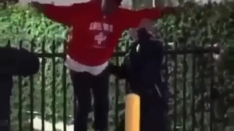 Instant Justice: Suspect gets stuck on a gate