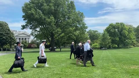 Biden Is Surrounded by His Handlers as He Shuffles Off to Delaware