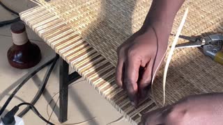 How rattan matt weaving is done on boards.