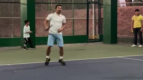 Manny Pacquiao learning tennis