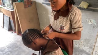 Blind Girl Expertly Braids Hair