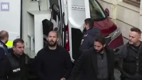 Andrew Tate yells 'You know I'm innocent' as he arrives at Romanian court with his brother and two female 'accomplices'