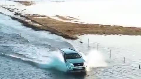 Funny people, crazy driver goes though deep ocen water on his ride home