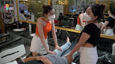 Being massaged by two girls in a barbershop is a healthier experience than tonic