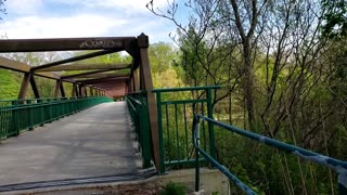 Beautiful green space along the Thames River with walkways, bridge in London ON