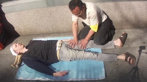 Luodong Massages Skinny White Man On Sidewalk