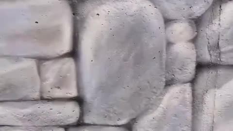 Spray Painting A Brick Wall