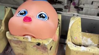 Manufacturer Paints Doll Heads