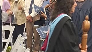 Joan tossing Graduation cap May the 4th be with you
