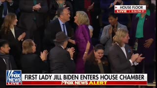 First lady and second gentleman share strange kiss at State of the Union.