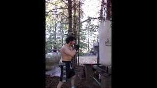 self trained Canadian man hits heavybag
