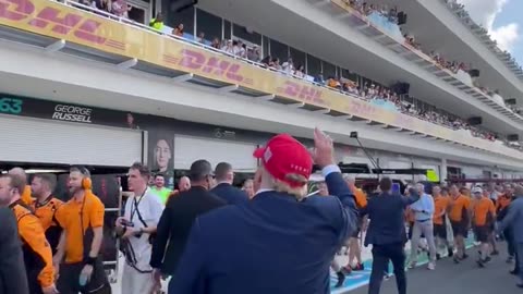 President Trump walking down F1