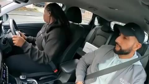 Young lady taking her driving test forgets something important