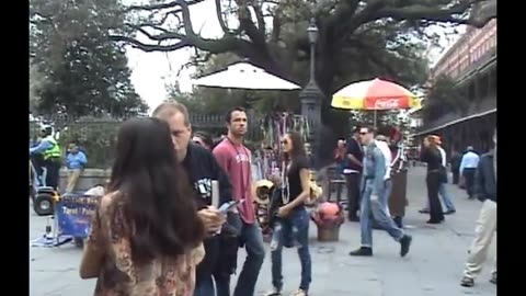 Wild Girl at Mardi Gras Flashes Street Preacher