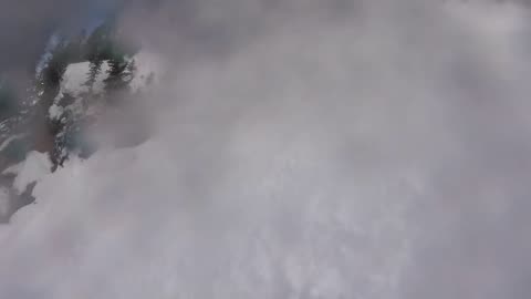 Dude tries to snowmobile up mountain, instantly regrets it