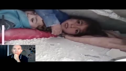 Little syrian girl and her baby brother found in rubble alive -she is protecting her baby brother