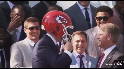 WATCH: Biden Bizarrely Puts On Chiefs Helmet, Mirrors Michael Dukakis Moment