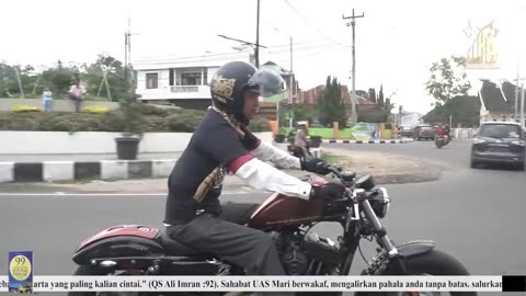 Ustaz Abdul Somad uses a touring motorbike to remind him of his philosophy